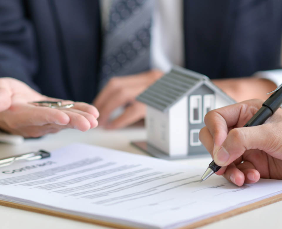 Signing a loan for a home purchase. Signing a loan for a home purchase.
